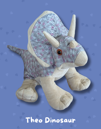 Brave child holding Theo Dinosaur comfort toy therapeutic healing plush hospital companion